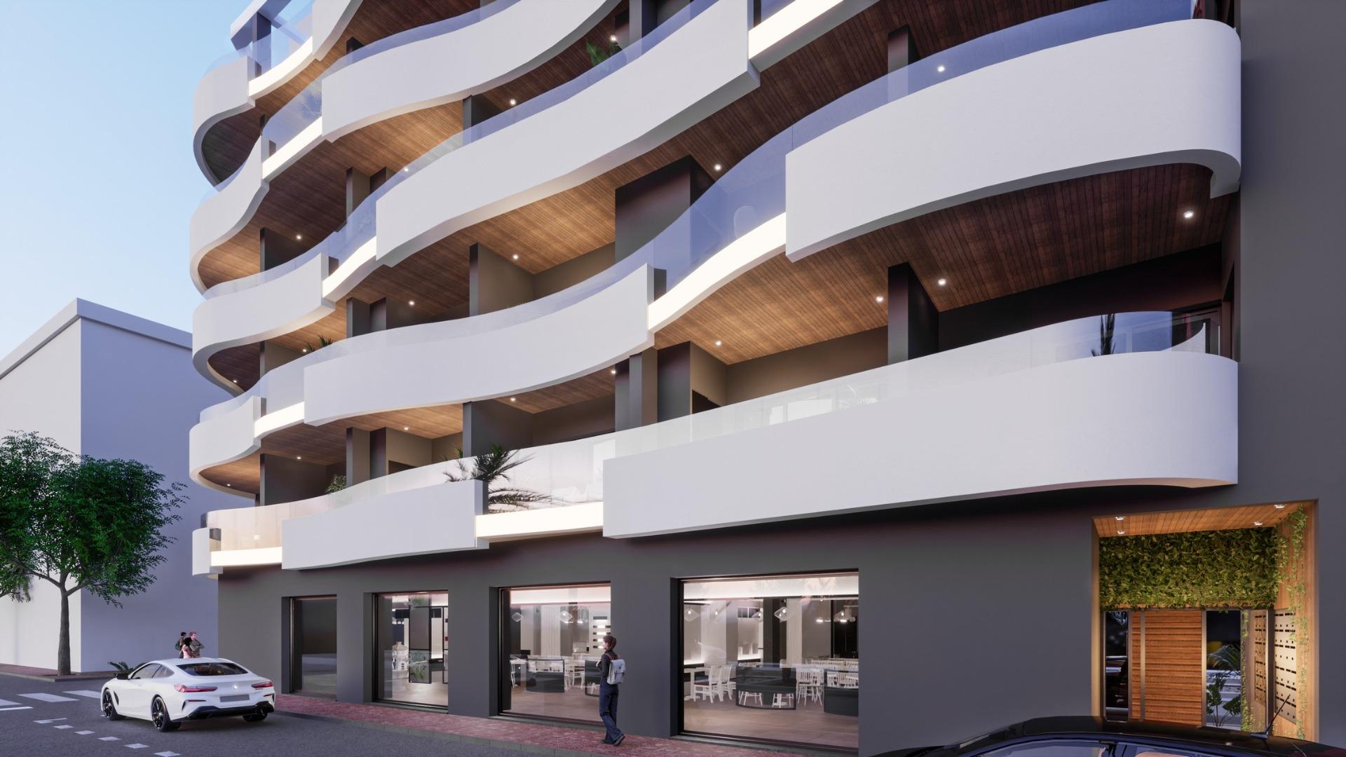 ATICOS DE OBRA NUEVA EN TORREVIEJA Nueva construcción de diseño vanguardista de cinco plantas en Torrevieja con 34 viviendas exclusivas ofrece una variedad de opciones de vida, desde elegantes ap...