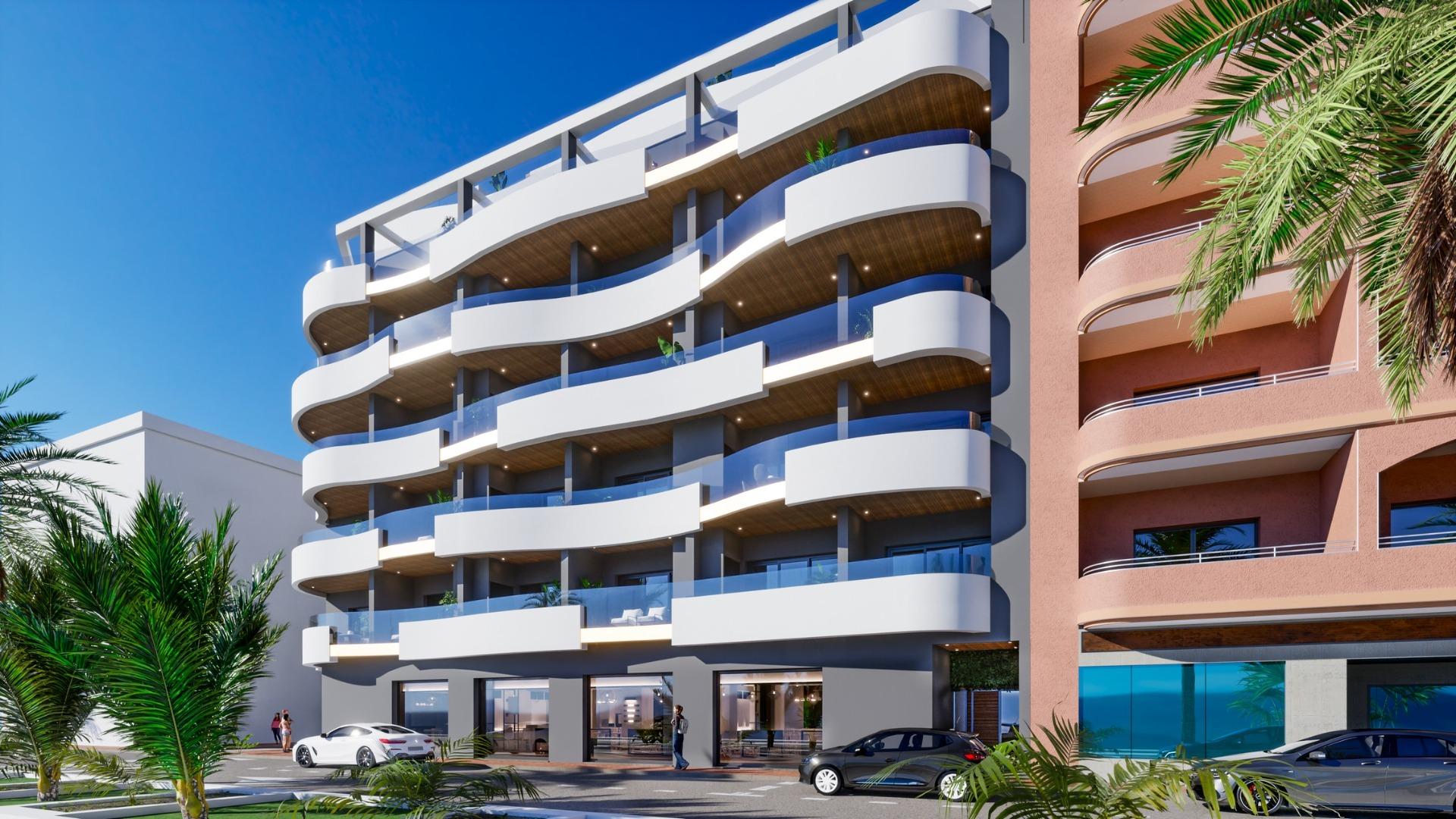 ATICOS DE OBRA NUEVA EN TORREVIEJA Nueva construcción de diseño vanguardista de cinco plantas en Torrevieja con 34 viviendas exclusivas ofrece una variedad de opciones de vida, desde elegantes ap...