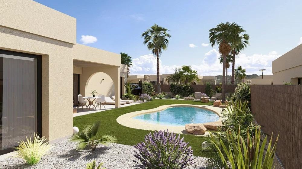 Backyard with a kidney-shaped pool, palm trees, and a patio seating area beside beige stucco homes on a sunny day.
