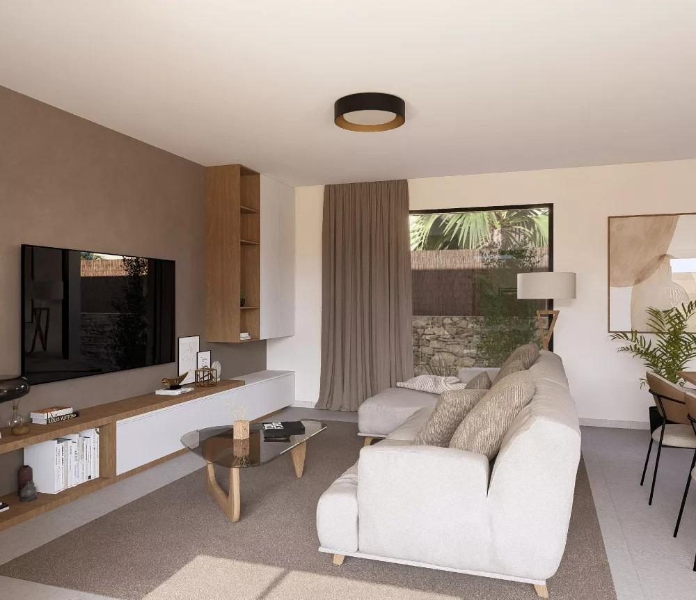 Cozy living room with a light gray sofa facing a wall-mounted TV and a glass coffee table in a bright, modern space.