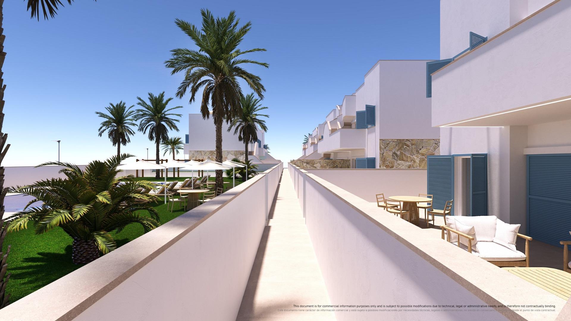 Sunny resort courtyard with white buildings, blue shutters, palm trees, and outdoor seating along a central walkway.