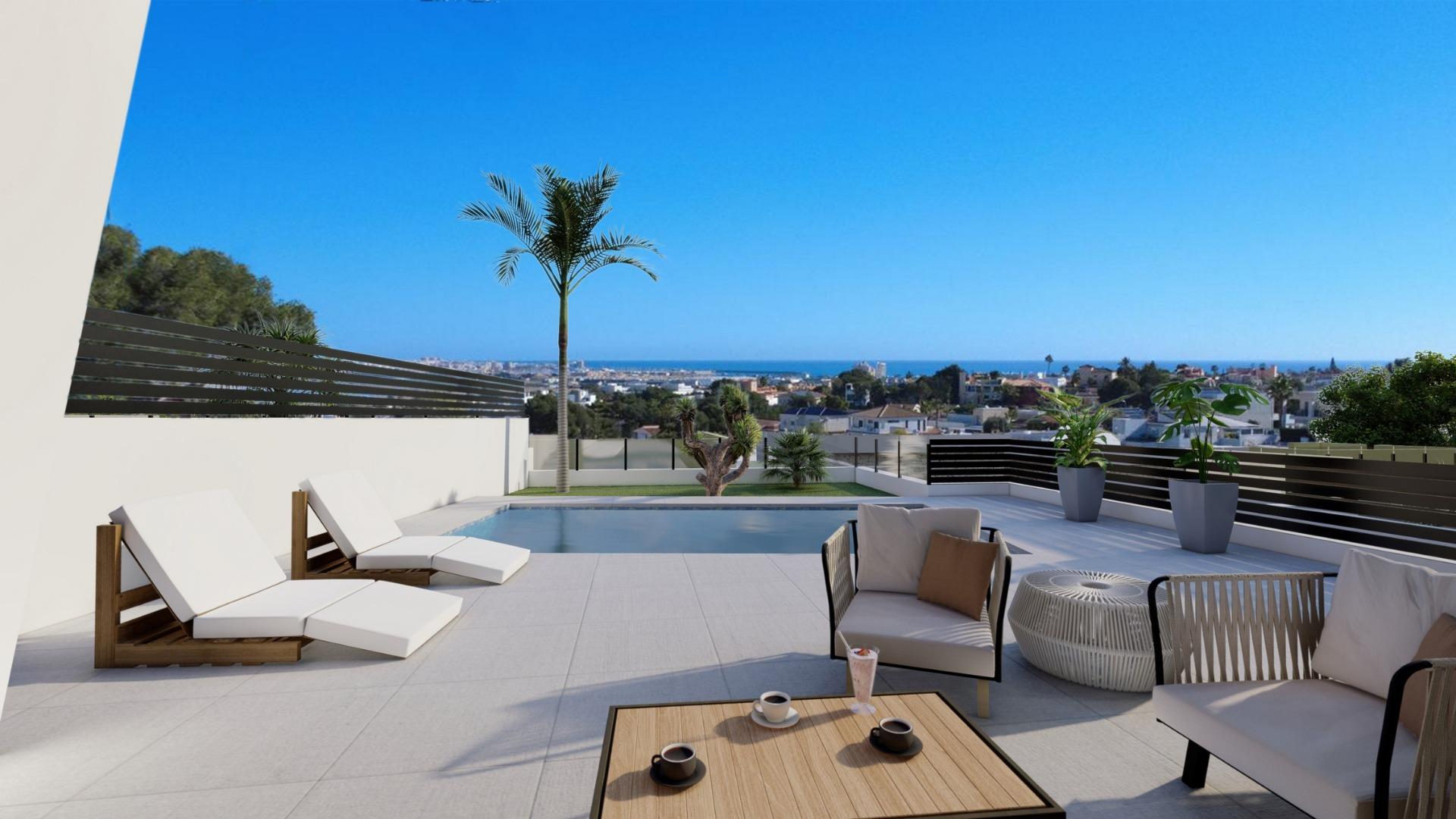 Sunny rooftop patio with a rectangular pool, white lounge chairs, and a panoramic ocean-view skyline.