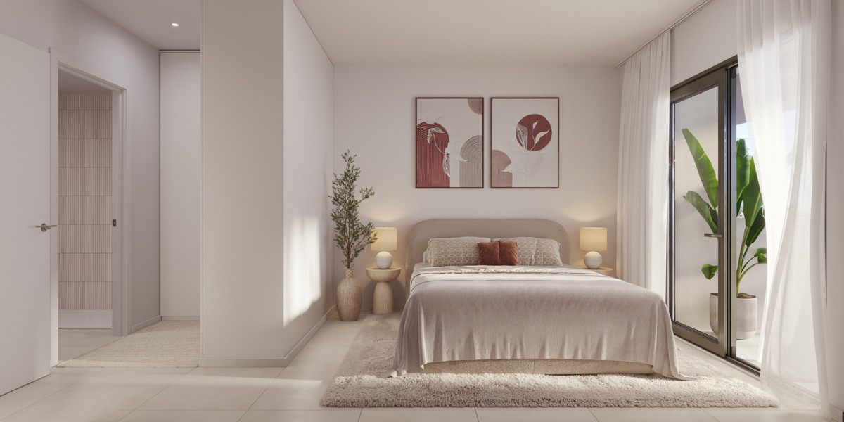 Neutral modern bedroom with a king bed, two nightstands, lamps, and framed abstract art above the headboard; plant in the corner and a glass balcony door with sheer curtains.