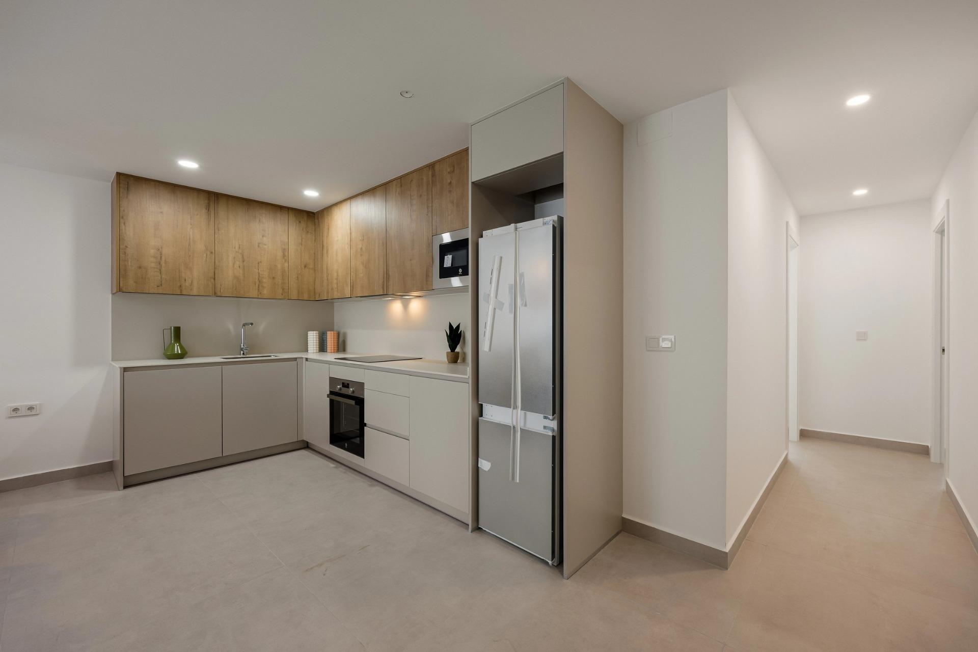 Apartamento en Venta en Villajoyosa, Inversión en Villajoyosa: 8 apartamentos obra nueva con licencia turística. Cerca del mar, 2 hab, terraza-jardín. ¡Sin comunidad! Alto potencial alquiler.